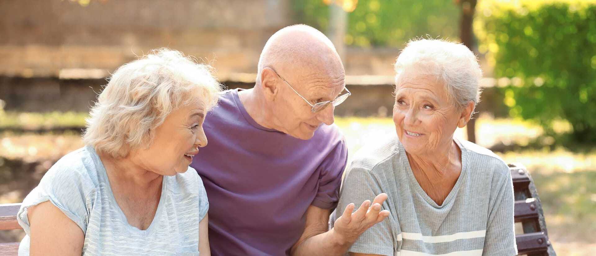 three seniors on a bench